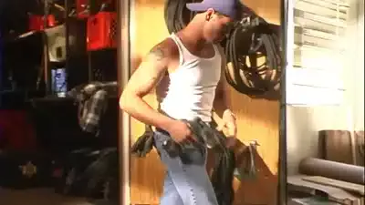 A pretty and cute chick with little braids fucks with a young handsome guy in the workshop