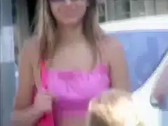 Saucy blonde babe walks around the town wearing revealing clothes
