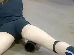 Sporty girl stretches right in front of me