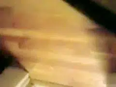 blonde coed throws things at the camera while trying to pee