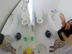 Beautiful housewife removes her clothes in order to wash her juicy holes