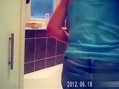 Foxy blonde with perky tits enjoys masterbating in the bathroom