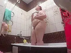 Lesbian has installed a in the bathroom at his girlfriend. Peeping behind a bbw with a big ass in the shower.