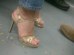 MILF in golden high heels