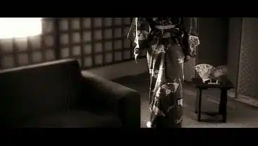 A cinematic shots of a geisha taking in her partner in elegant cowgirl